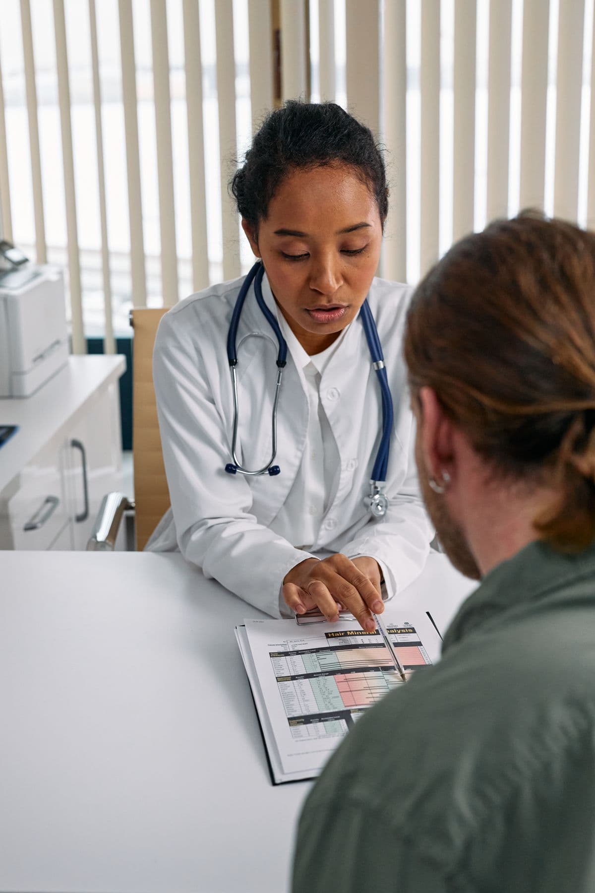 Healthcare provider holding patient's hands
